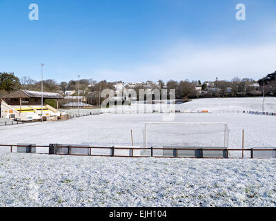 The pitch and stand of Bodmin Town Football Club, covered in snow. Stock Photo