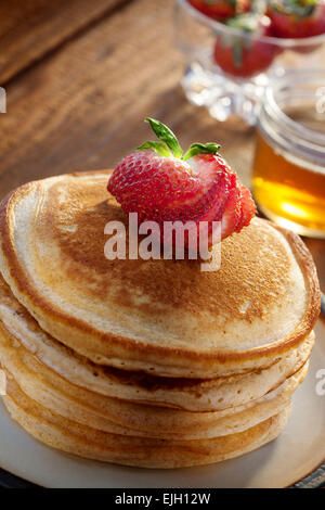 close up view of nice yummy pancakes on color back Stock Photo