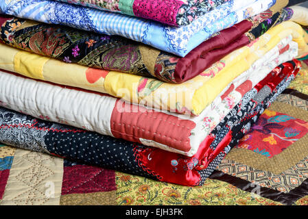 different colored patchwork stacked on a table Stock Photo