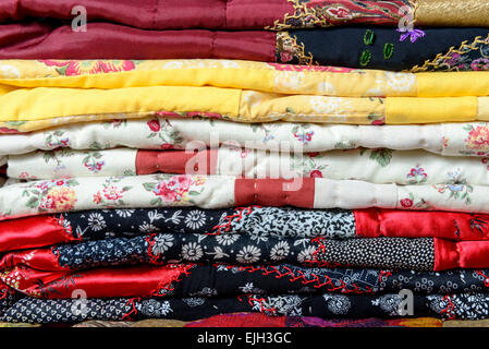 different colored patchwork stacked on a table Stock Photo