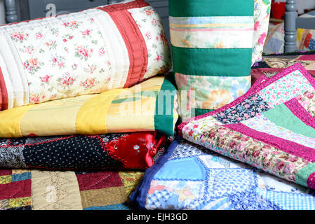 different colored patchwork stacked on a table Stock Photo