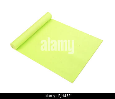 green yoga mat on a white background Stock Photo