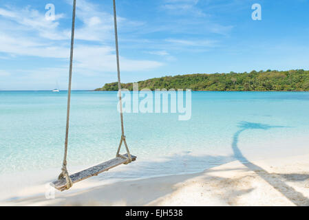 Summer, Travel, Vacation and Holiday concept - Swing hang from coconut palm tree over beach sea in Phuket ,Thailand.