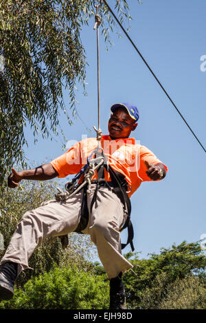 Johannesburg South Africa,African Croc City Crocodile & and Reptile Park,farm,zip-line,Black Blacks African Africans ethnic minority,adult adults man Stock Photo