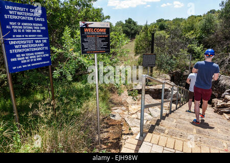 Johannesburg South Africa,African Muldersdrift,Sterkfontein Caves,hominin,hominid site,human ancestor,Cradle of Humankind,cave entrance,signs,adult ad Stock Photo