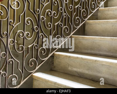 Ornate wrought iron railing on the stairway of a once grand Vedado mansion. Stock Photo