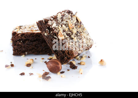 Cocoa and chocolate brownies dessert with hazelnut isolated on white background Stock Photo