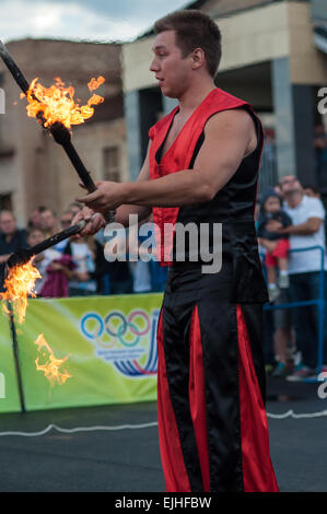 ORENBURG, ORENBURG region, RUSSIA, 25 July, 2014 year. Juggling flaming batons Stock Photo