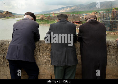 View of Hasankeyf, ancient town near Batman, Turkish Kurdistan, Turkey. Old Kurdish men, friends talking Stock Photo