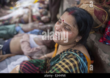 Narayangonj, Bangladesh. 27th Mar, 2015. Relatives are c rying near dead body who died in a stampede during the ''˜Astami snan', the Hindu holy bath in the Old Brahmaputra River. Credit:  ZUMA Press, Inc./Alamy Live News Stock Photo