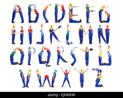 Alphabet formed from young people wearing industrial uniforms and helmets posing with various tools and accessories Stock Photo