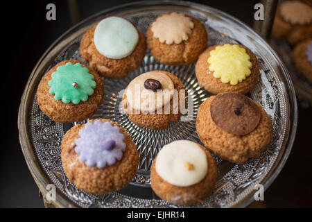 Cream puffs on dishes, Odette pastry shop, Paris, France Stock Photo