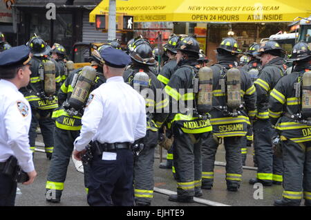 Firefighters respond to an explosion and partial building collapse, in ...