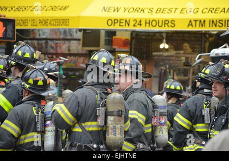 Firefighters respond to an explosion and partial building collapse, in ...