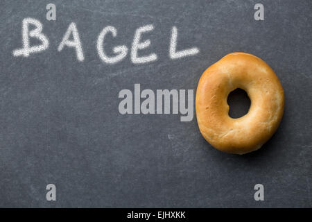 the tasty bagel on chalkboard Stock Photo