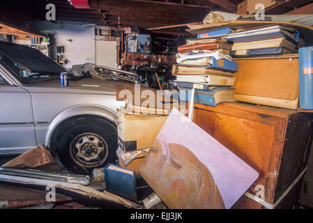 LOS ANGELES, CA – OCTOBER 1: People surrounded with clutter in their homes in Los Angeles, California on October 1, 1999. Stock Photo