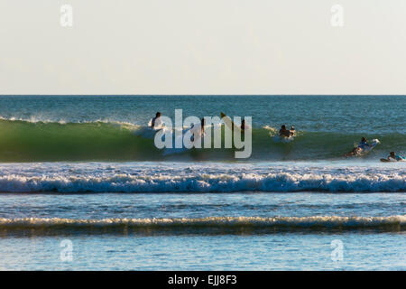 Surfers on the beach in Kuta, Bali island, Indonesia Stock Photo