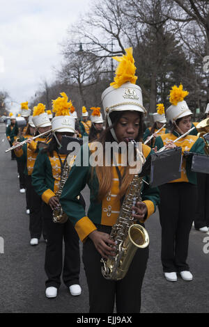 High School marching band performs at the St. Patrick's Day Parade in Park Slope, Brooklyn, NY. Stock Photo