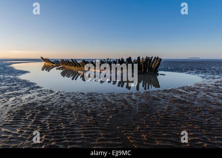 Shipwreck of The SS Nornen at sunset on Berrow Sands near Burnham on Sea, North Somerset, England, UK Stock Photo