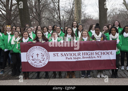 Teenage girls from Saint Saviour High School display the school banner, ready to march in the annual Irish Parade in Brooklyn, N Stock Photo