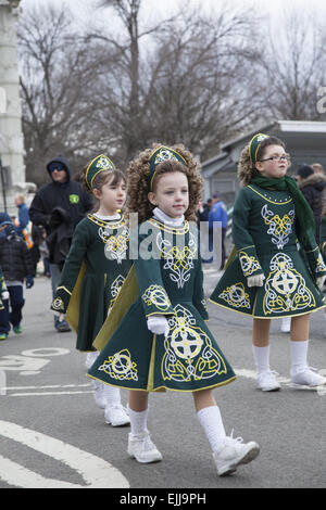 Girls from a local Irish dance school perform at the Irish Day Parade ...