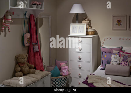 Modern children room full of toys, teddies and cushions Stock Photo