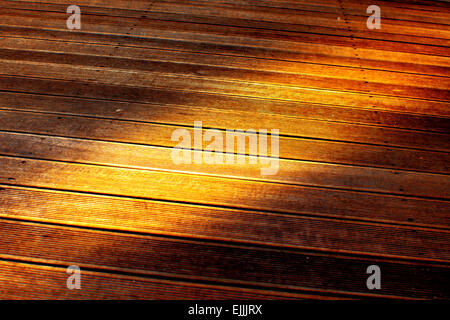 Wooden paving with brown battens texture. Stock Photo