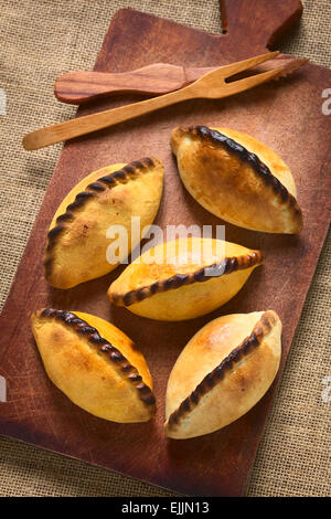 Traditional Bolivian savory pastries called Saltena filled with thick meat stew, which is a popular street snack in Bolivia Stock Photo