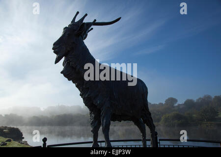 King Puck goat statue silhouetted against the River Laune, Killorglin, County Kerry, Ireland. Stock Photo