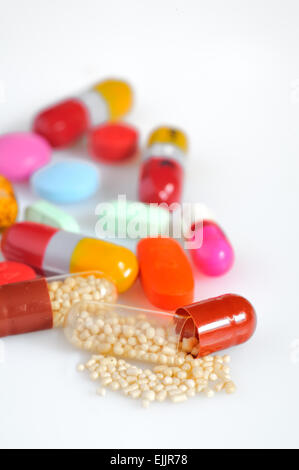 Many colorful pills isolated on white Stock Photo