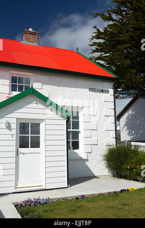 Falklands, Port Stanley, Victory Green, Marmont Row, whitewashed seafront house with red roof Stock Photo