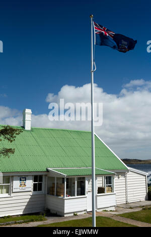 Falklands, Port Stanley, Falkland Islands flag flying outside Gilbert House, Legislative Assembly Office Stock Photo