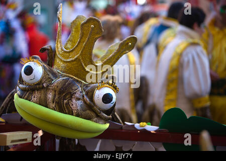 Costume of crown frog resting on stand while performers make preparations to take part in the Carnival parade of comparsas at Ba Stock Photo