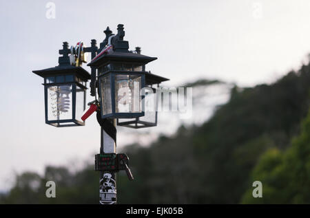 love locks on lantern lamp pole Stock Photo