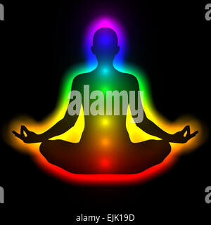 Woman in meditation with aura and chakras Stock Photo