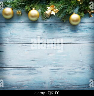 Christmas decoration with fur and baubles on old wood. Stock Photo