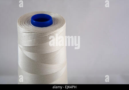 Cotton thread on spools isolated on white background Stock Photo