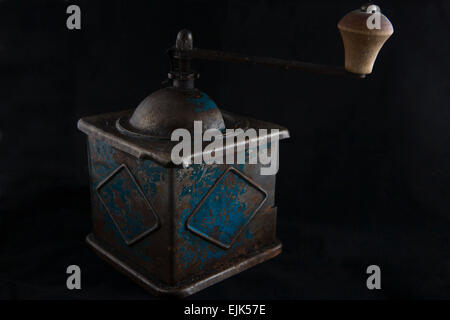 Old manual coffee grinder isolated over black background Stock Photo