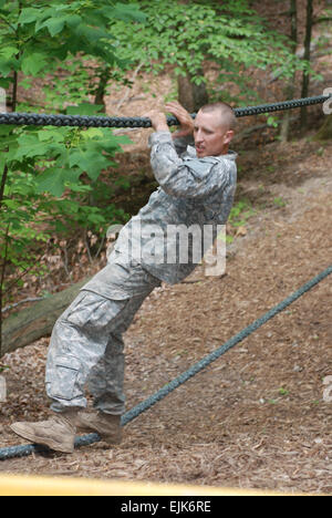 Staff Sgt. Joshua Marshall from the U.S. Army Reserve 100th Division performs the rope walk at the obstacle course at Fort Eustis, Va          Army names top drill sergeants for 2009  /-news/2009/06/26/23536-army-names-top-drill-sergeants-for-2009/index.html Stock Photo