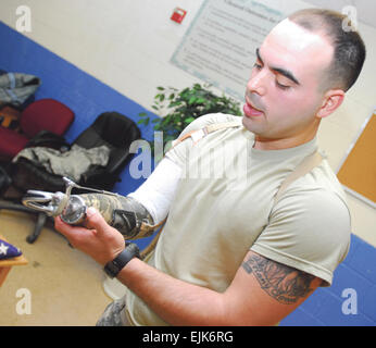 Staff Sgt. Luis Elias lost his right hand in June of 2009, but prosthetic devices and a robotic bionic hand got him back on the job as a drill sergeant.          Drill sergeant returns to duty following amputation  /-news/2010/02/11/34332-drill-sergeant-returns-to-duty-following-amputation/index.html Stock Photo