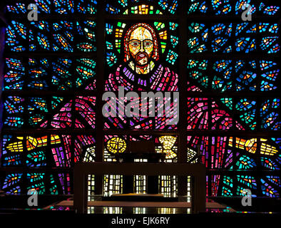 Stained-glass window in the chapel of Buckfast Abbey, designed by monks, near Buckfastleigh, Devon, England, Great Britain, UK. Stock Photo