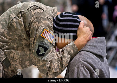 Soldiers say their final goodbyes during a farewell ceremony on McEntire Joint National Guard Base, S.C., Jan. 26, 2013. The soldiers, assigned to the South Carolina Army National Guard, will head to Fort Hood, Texas, to train before deploying to Afghanistan. National Guard photo by Staff Sgt. Jorge Intriago Stock Photo