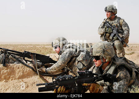 U.S. paratroopers position themselves to provide fire support for their fellow paratroopers and Iraqi national police officers as they prepare to clear a nearby village during Operation Winged Lion II, an Iraqi-led air assault mission in the Ma'dain region outside eastern Baghdad, Iraq, June 26, 2009. The paratroopers are assigned to the   82nd Airborne Division's Troop K, 5th Squadron, 73rd Cavalry.  Sgt. 1st Class Alex Licea Stock Photo