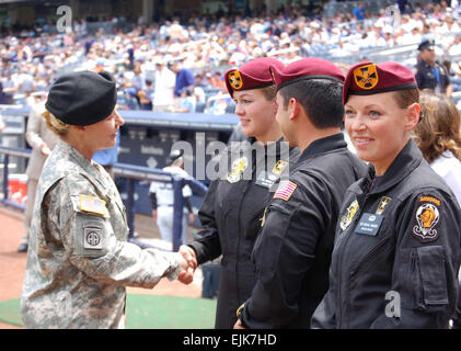 Gen. Ann E. Dunwoody, commander, U.S. Army Materiel Command, speaks with members of the U.S. Army Parachute Team, the Golden Knights, at Yankee Stadium prior to the Army Appreciation Game June 14. The Golden Knights jumped into the stadium, and Gen. Dunwoody threw out the first pitch to start the game in celebration of the Army's 234th Birthday. photo by Sgt. 1st Class Richard A. Guzman, New York City Recruiting Battalion Stock Photo