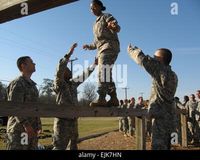 U.S. Army Soldiers from Bravo Company, 3rd Battailon, 11th Infantry Regiment walk along to provide safety as a fellow Soldier navigates an obstacle on Bolton Confidence Course at Fort Benning, Ga., March 13, 2008.  Soldiers with the company are in their first week of Officer Candidate School.  Kenneth R. Toole Stock Photo