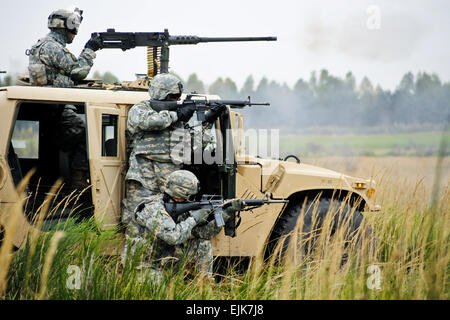 U.S. Soldiers assigned to the 18th Combat Sustainment Support Brigade perform a platoon mounted and dismounted live-fire exercise at Grafenwoehr Training Area in Germany Oct. 6, 2010.  Gertrud Zach, U.S. Army Stock Photo