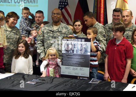From left, U.S. Army Brig. Gen. Susan S. Lawrence, Command Sgt. Maj. Roderick D. Johnson, Lt. Col. David W. Astin and Command Sgt. Maj. Harold Littlejohn pose with the freshly signed Army Covenant and families from the Darmstadt community military community at Lincohn Village Housing in Darmstadt, Germany, Nov. 5, 2007.  Martin Greeson Stock Photo