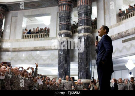 President Barack Obama speaks to hundreds of U.S. troops during his April 7, 2009, visit at Camp Victory, Iraq. &quot;... As long as I'm in the White House, you're going to get the support you need and the thanks that you deserve from a grateful nation,&quot; Obama told the troops.  White House photo by Pete Souza Stock Photo