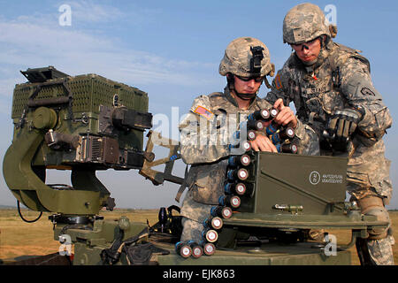 U.S. Army Spc. Timothy Cooke, left, and Sgt. Kyle O'Leary prepare to shoot a grenade launcher during range training at Exercise Yudh Abhyas in Babina, India, Oct. 15, 2009. The bilateral exercise involves the armies of India and the United States, and all soldiers are assigned to the 25th Infantry Division's 2nd Squadron, 14th Cavalry Regiment, 2nd Stryker Brigade Combat Team.  Staff Sgt. Crista Yazzie Stock Photo