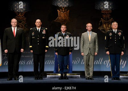The Deputy Secretary of Defense Robert O. Work, The Chief of Staff of the Army Gen. Raymond T. Odierno, Medal of Honor recipient Former U.S. Army Sgt. Kyle White, the Under Secretary of the Army Brad R. Carson, and Sgt. Maj. of the Army Raymond F. Chandler III, stand during White’s Hall of Heroes induction ceremony at the Pentagon in Washington, D.C., May 14, 2014. White was recognized for his actions during his deployment to Afghanistan in 2007 while serving with Chosen Company, 2nd Battalion Airborne, 503rd Infantry Regiment, 173rd Airborne Brigade.  U.S. Army  Sgt. Laura Buchta Stock Photo